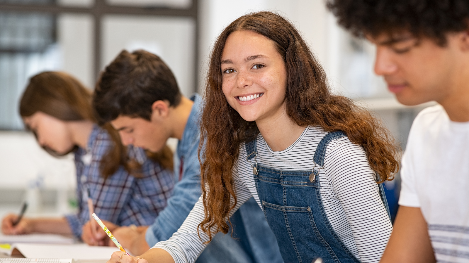 High school girl doing a project-based learning task during women's history month