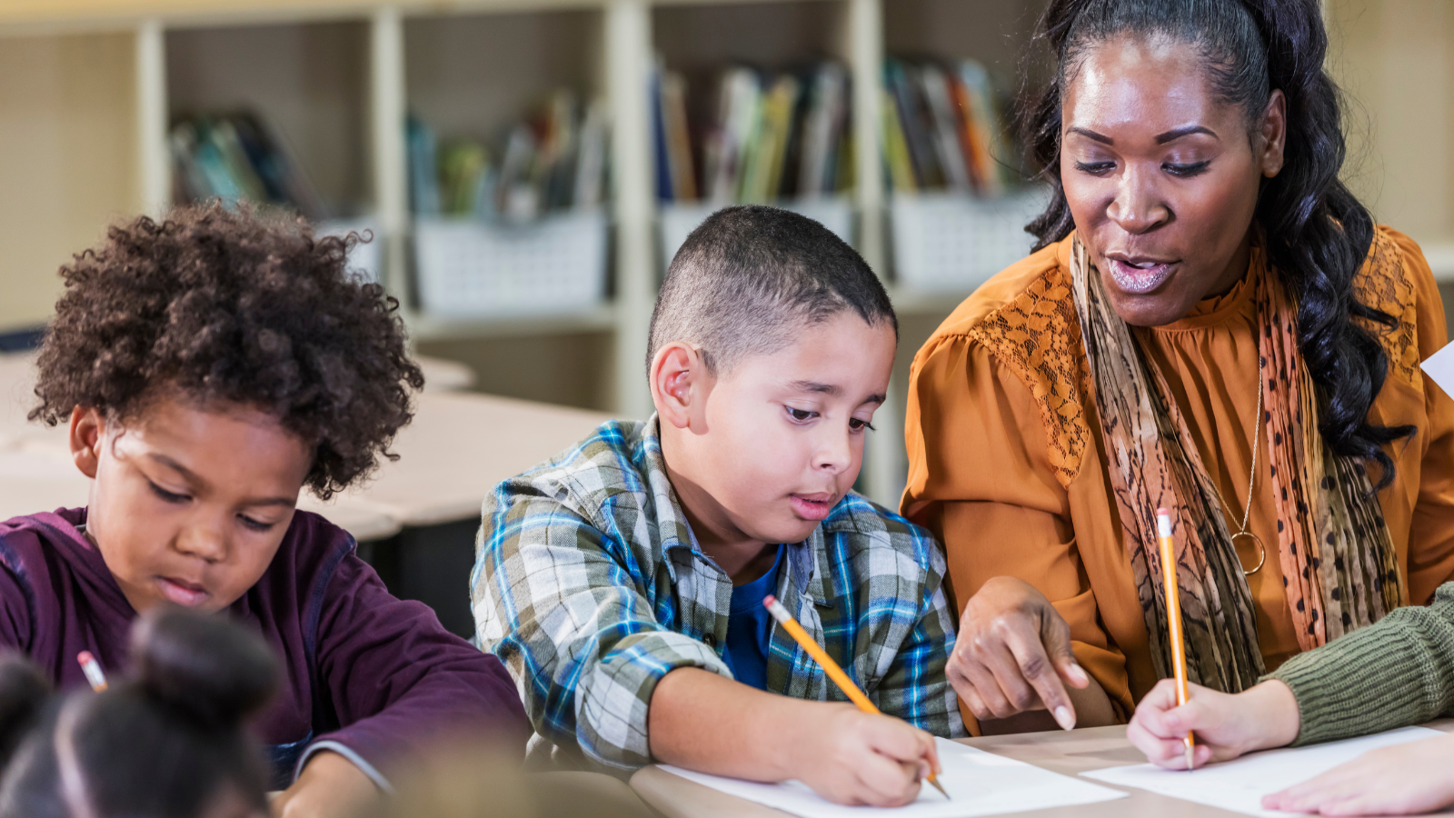 Students writing using project-based learning focused on equitable instruction and text-based writing