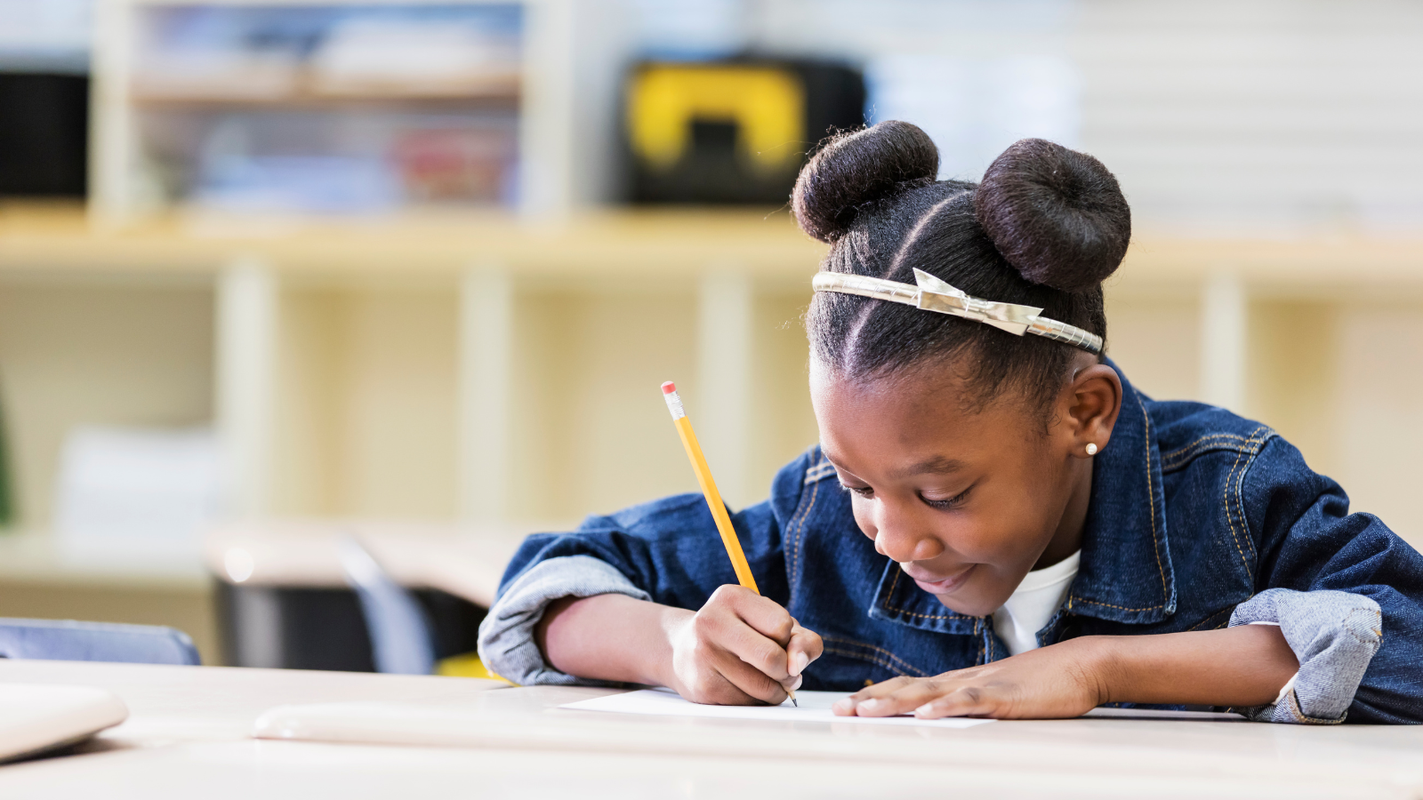 Fourth-grade student exercising social-emotional learning writing a letter to future self