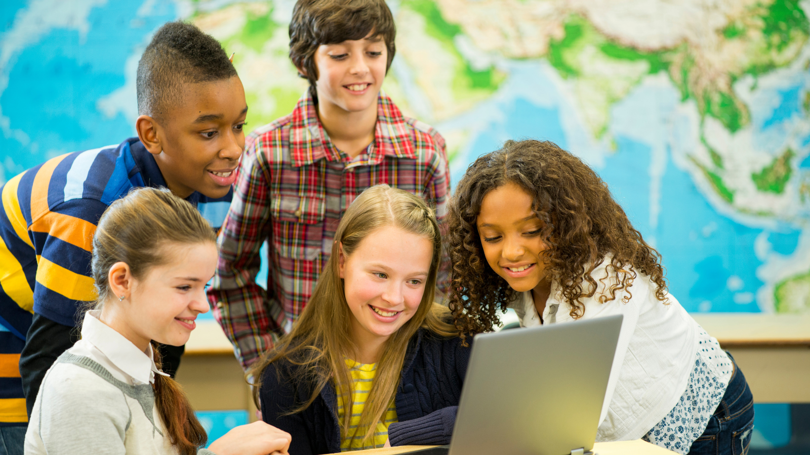 Middle school students collaborating on project
